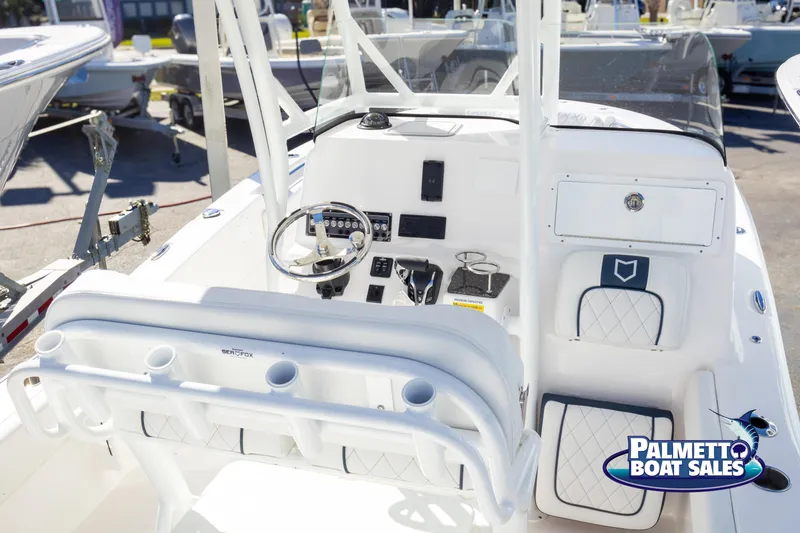 Slide: The Image of 2025 Sea Fox 248 Side Console boat interior with steering wheel and controls. - 10