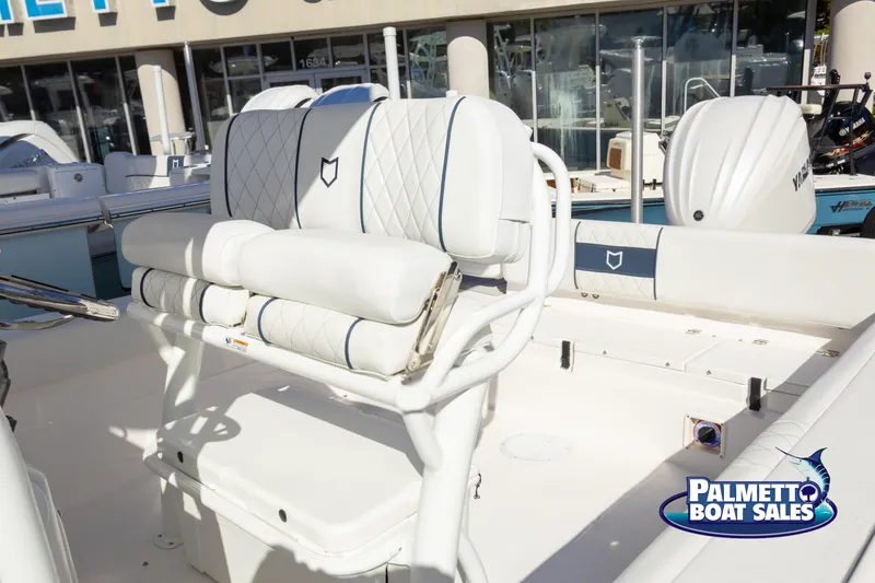 Slide: The Image of 2025 Sea Fox 248 Side Console boat interior with white seating at Palmetto Boat Sales. - 17