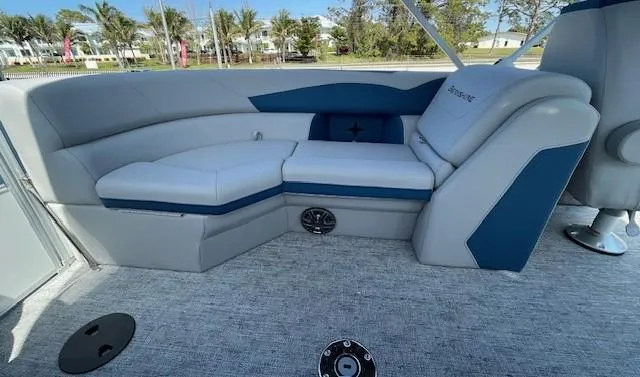 Slide: The Image of 2025 Berkshire 22 RFX LE Tri-toon Pontoon interior seating with blue and gray upholstery. - 11