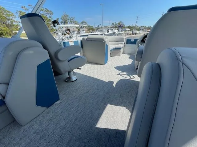 Slide: The Image of 2025 Berkshire 22 RFX LE Tri-toon Pontoon interior with plush seating and modern design. - 12