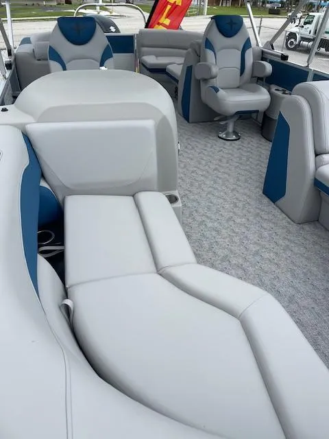 Slide: The Image of 2025 Berkshire 22 RFX LE Tri-toon Pontoon interior with plush seating and modern design. - 13