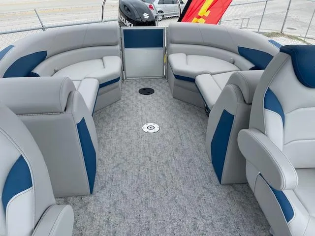 Slide: The Image of 2025 Berkshire 22 RFX LE Tri-toon Pontoon interior with plush seating and modern design. - 16