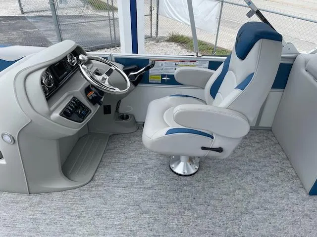 Slide: The Image of Captain's chair and helm of 2025 Berkshire 22 RFX LE Tri-toon Pontoon. - 17
