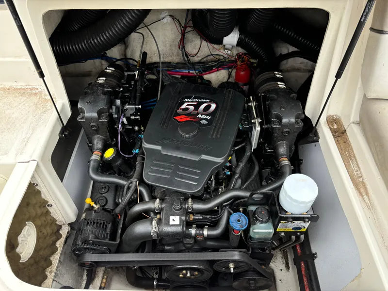 Slide: The Image of 2004 Sea Ray 200 Sundeck engine compartment with MerCruiser 5.0 MPI motor. - 2