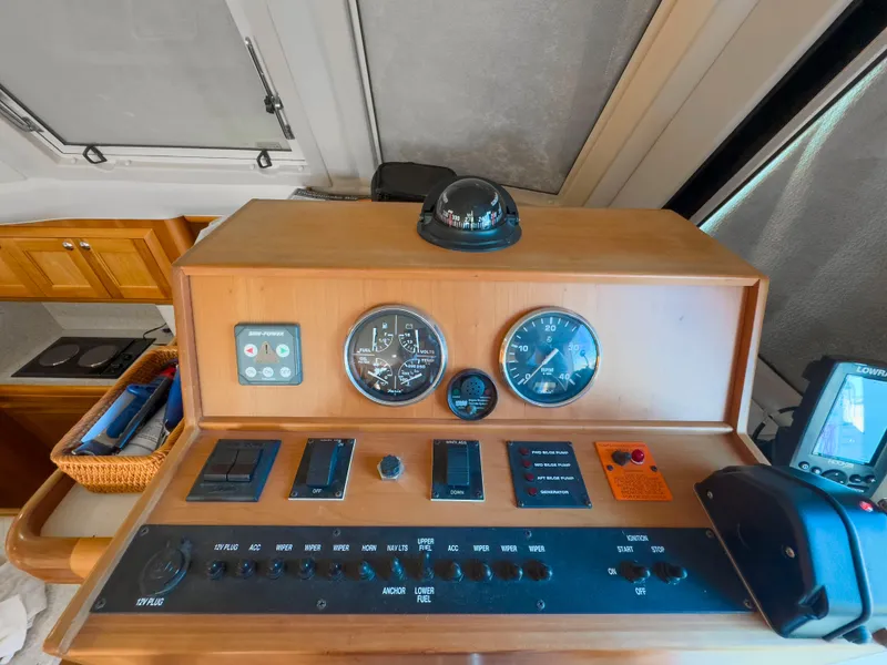 Slide: The Image of Control panel of 2005 Mainship 34 Trawler with gauges and navigation equipment. - 10