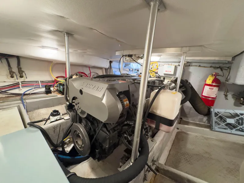 Slide: The Image of Engine room of 2005 Mainship 34 Trawler with Yanmar engine and fire extinguisher. - 26