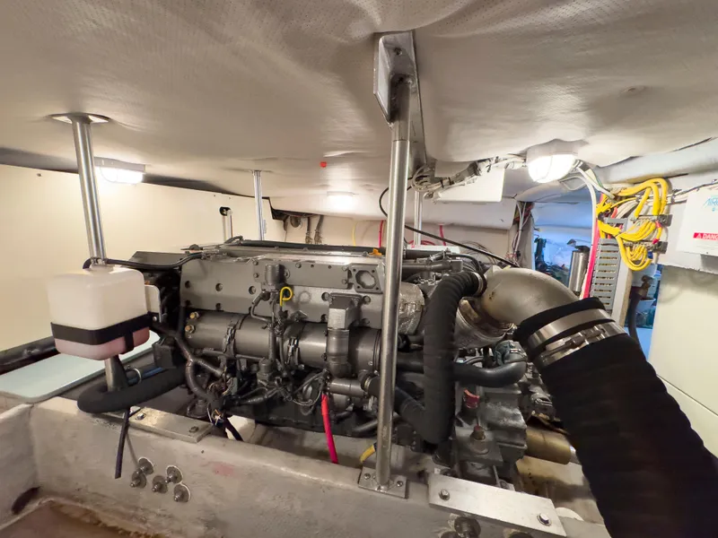 Slide: The Image of Engine room of 2005 Mainship 34 Trawler, showcasing detailed mechanical components. - 27