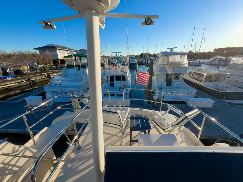 Slide: The Image of 2005 Mainship 34 Trawler docked at marina with other boats, sunny day. - 41