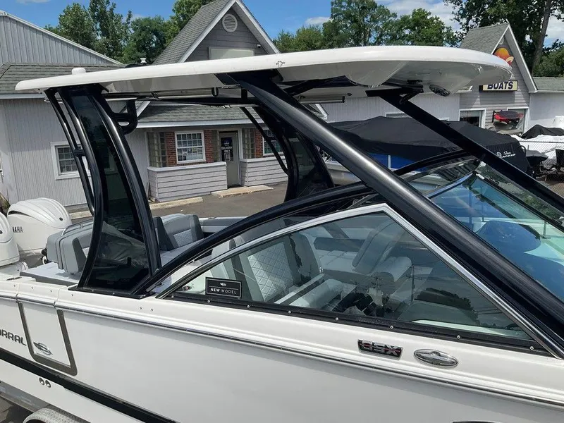 Slide: The Image of 2025 Chaparral 310 OSX boat with sleek design and modern features. - 29