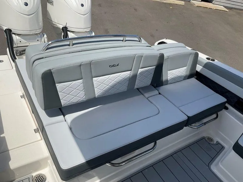 Slide: The Image of 2025 Chaparral 310 OSX boat seating with Yamaha engines, featuring gray and white cushioned design. - 39