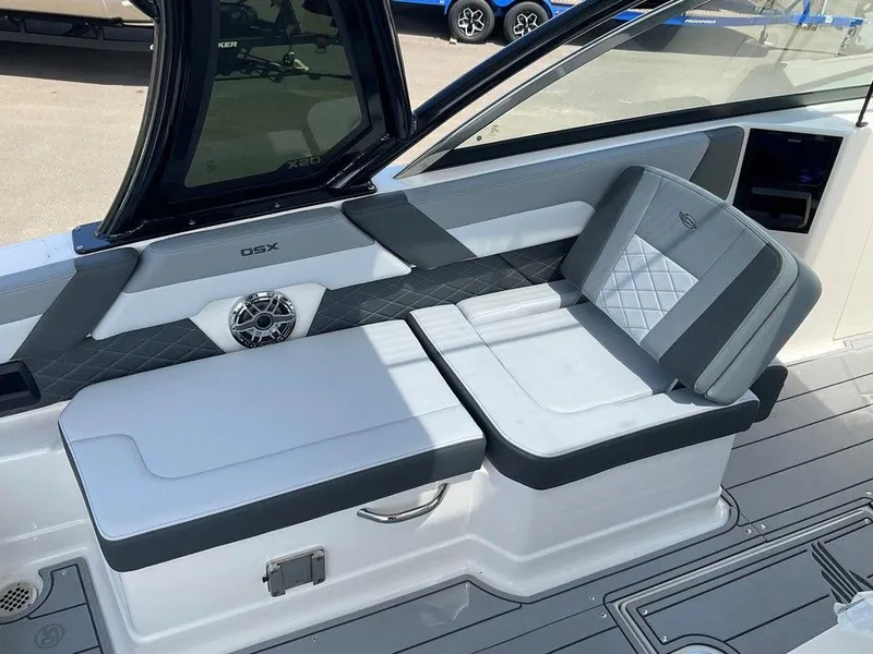 Slide: The Image of 2025 Chaparral 310 OSX boat interior with stylish seating and modern design. - 41