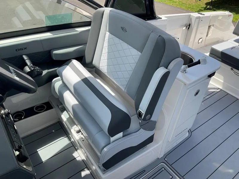 Slide: The Image of 2025 Chaparral 310 OSX boat interior with luxurious seating and modern design. - 44