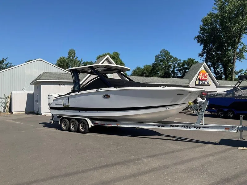 Slide: The Image of 2025 Chaparral 310 OSX boat on trailer at A&S Boats dealership. - 7