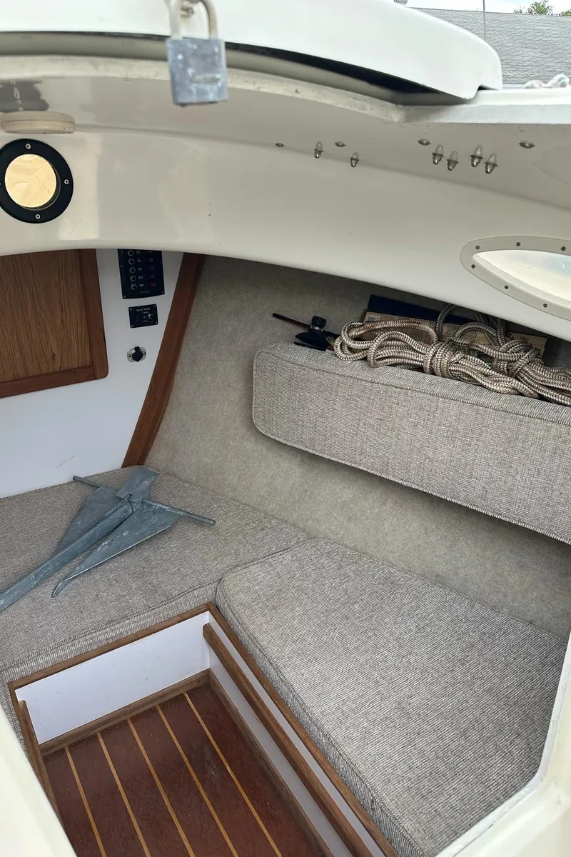 Slide: The Image of 2014 Com-Pac Horizon Day Cat cabin interior with cushions and anchor. - 8