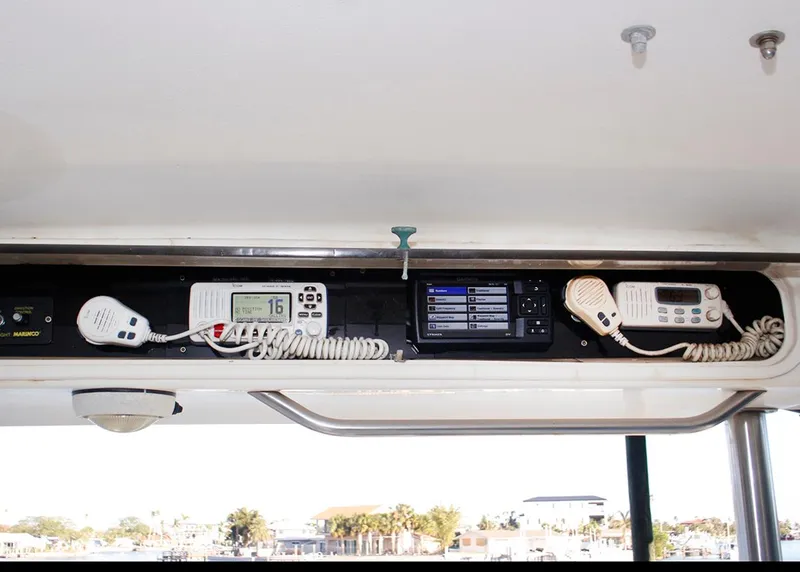 Slide: The Image of Interior electronics of 1988 Ocean Yachts 38 Super Sport, featuring communication devices. - 12