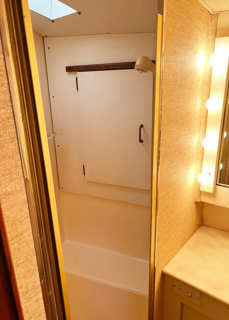 Slide: The Image of 1988 Ocean Yachts 38 Super Sport bathroom with shower and vanity lighting. - 20