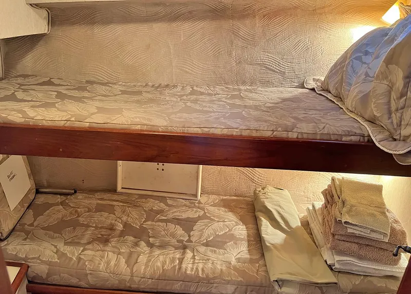 Slide: The Image of Cozy bunk beds in 1988 Ocean Yachts 38 Super Sport cabin. - 22