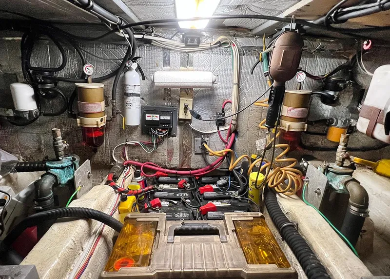 Slide: The Image of Engine room of 1988 Ocean Yachts 38 Super Sport with wiring and equipment. - 23