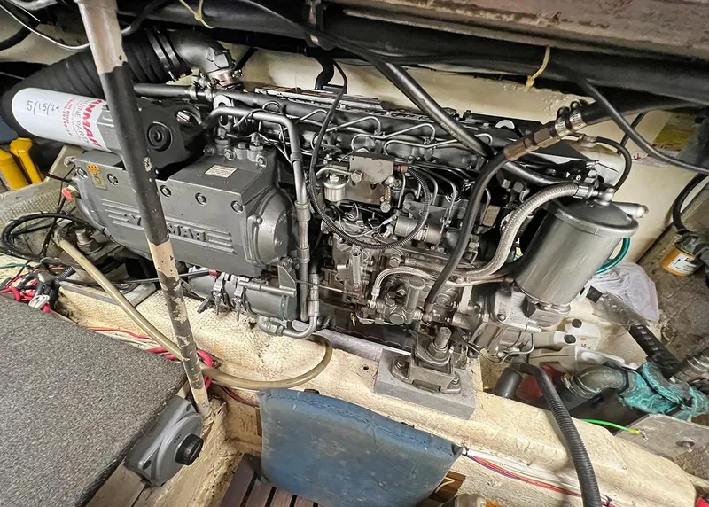 Slide: The Image of Engine room of 1988 Ocean Yachts 38 Super Sport, showcasing detailed machinery and components. - 25