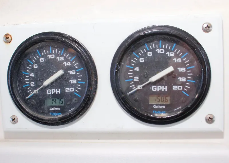 Slide: The Image of Fuel gauges on 1988 Ocean Yachts 38 Super Sport, displaying GPH readings. - 26