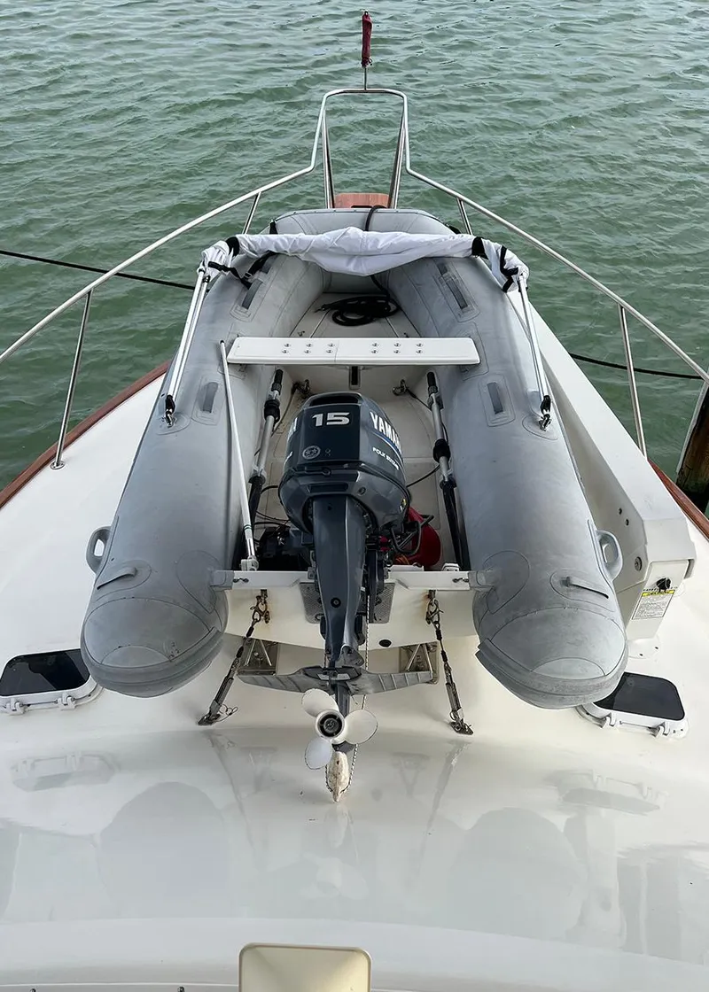 Slide: The Image of 1988 Ocean Yachts 38 Super Sport with inflatable dinghy and outboard motor on deck. - 29