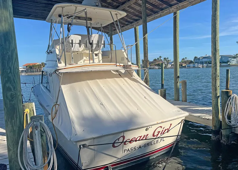 Slide: The Image of 1988 Ocean Yachts 38 Super Sport docked, named "Ocean Girl," in Pass-A-Grille, Florida. - 5