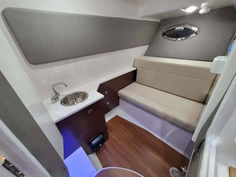 Slide: The Image of Interior of 2025 Chaparral 280 OSX boat with seating and sink area. - 6