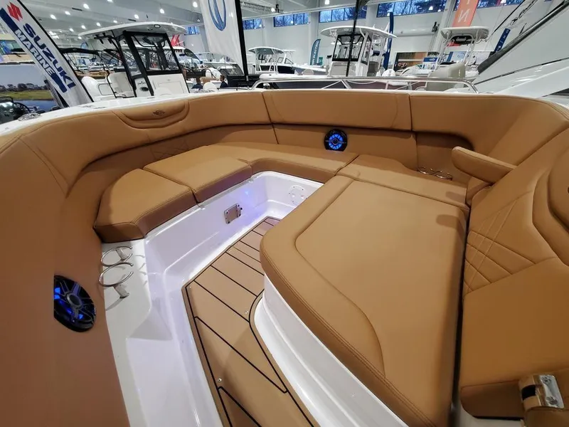 Slide: The Image of Luxurious interior of 2025 Chaparral 280 OSX boat with tan seating and modern design. - 8