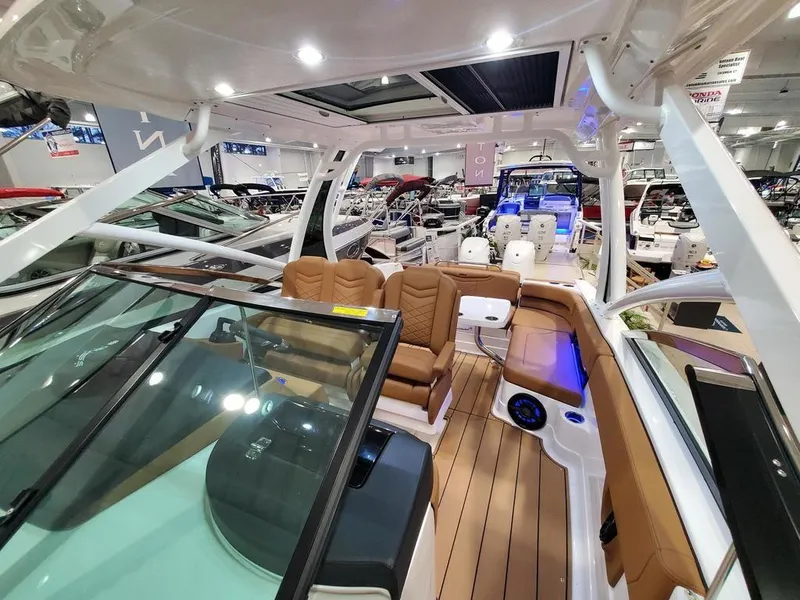 Slide: The Image of 2025 Chaparral 280 OSX boat interior with luxurious seating and modern design. - 9