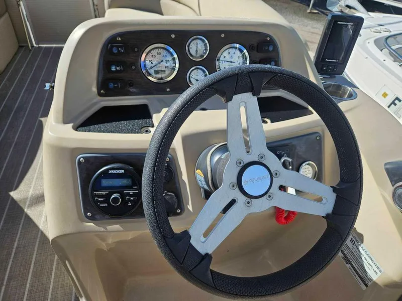 Slide: The Image of Steering console of 2019 Manitou 22 Aurora LE 220VP Tritoon Pontoon with gauges and controls. - 10