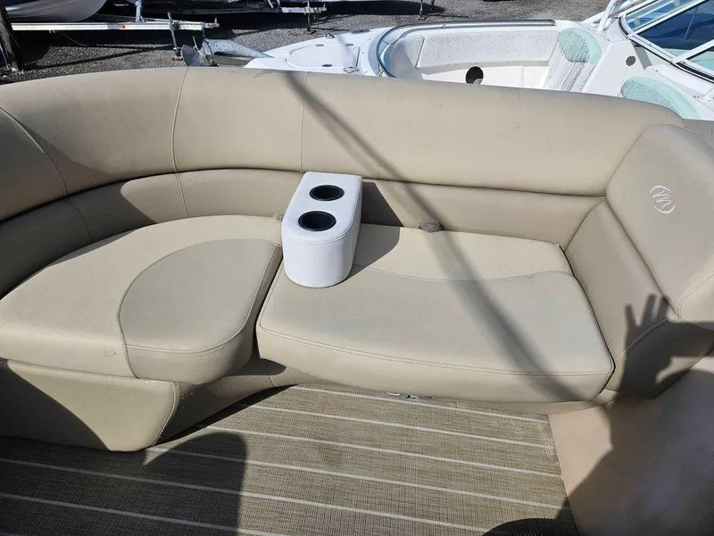 Slide: The Image of 2019 Manitou 22 Aurora LE 220VP Tritoon Pontoon with beige seating and cup holders. - 7