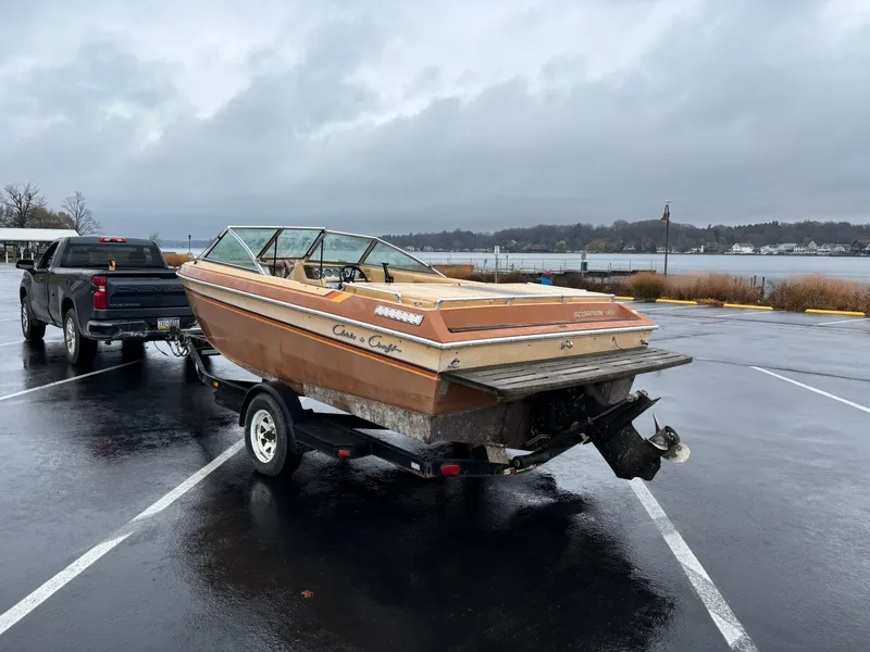 Slide: The Image of 1984 Chris-Craft 186 BR Scorpion boat on trailer in parking lot. - 6