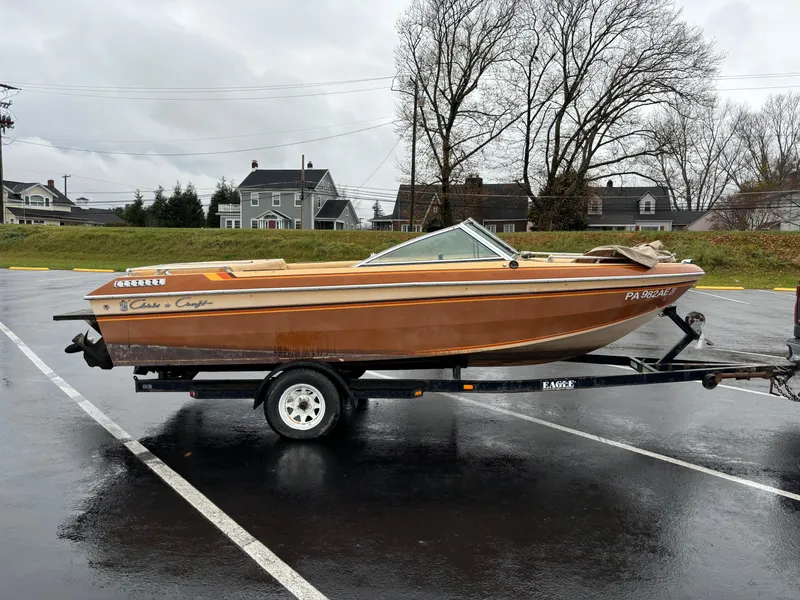 Slide: The Image of 1984 Chris-Craft 186 BR Scorpion boat on trailer in parking lot. - 8
