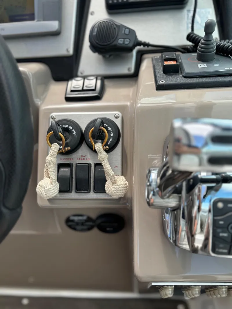 Slide: The Image of Control panel of a 2011 Cruisers Yachts 330 Express boat. - 18