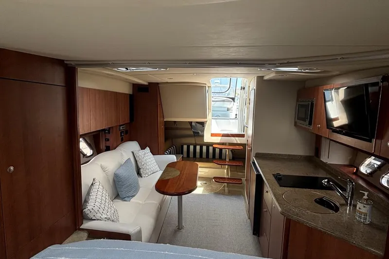 Slide: The Image of Luxurious interior of 2011 Cruisers Yachts 330 Express with modern amenities and cozy seating. - 24