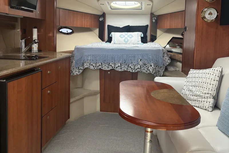 Slide: The Image of Luxurious interior of 2011 Cruisers Yachts 330 Express with cozy bed and elegant wood finishes. - 27