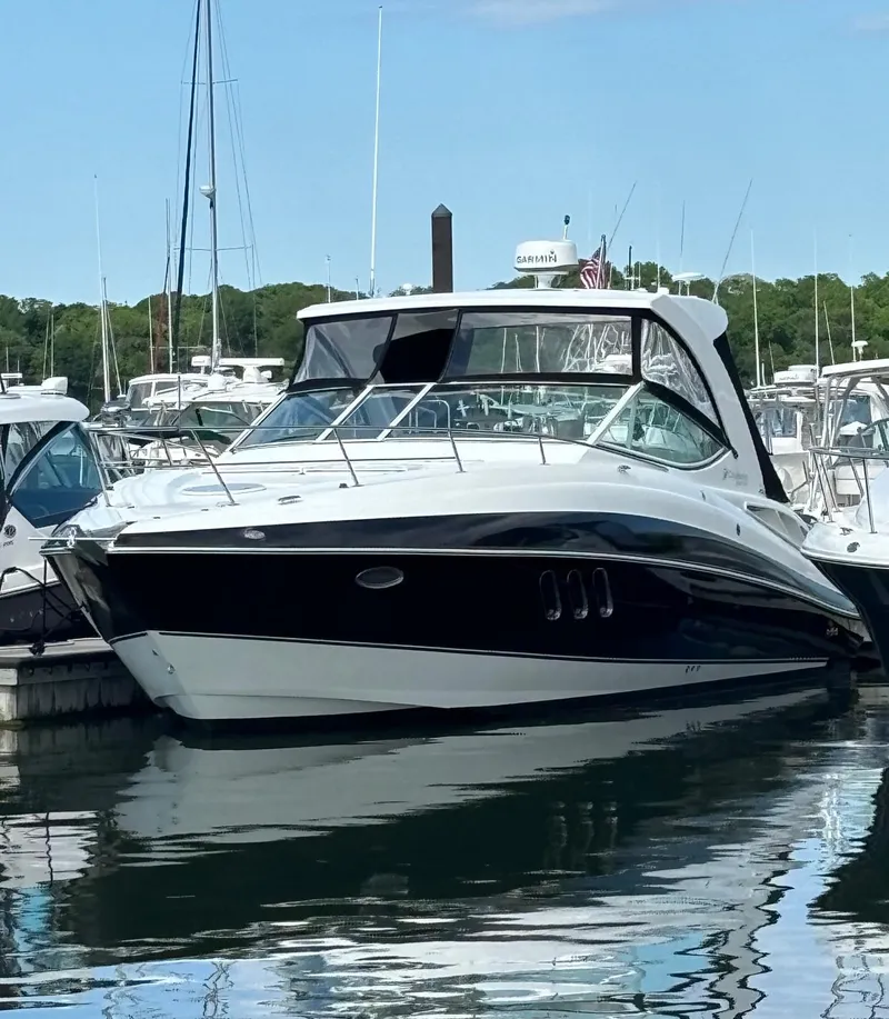 The Image of 2011 Cruisers Yachts 330 Express docked in a marina. - 0