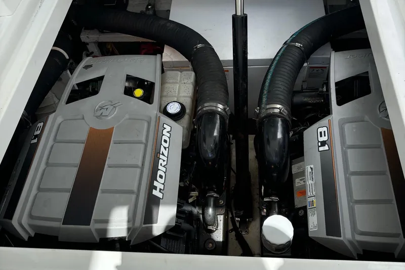 Slide: The Image of 2011 Cruisers Yachts 330 Express engine compartment with twin Horizon 8.1 engines. - 29