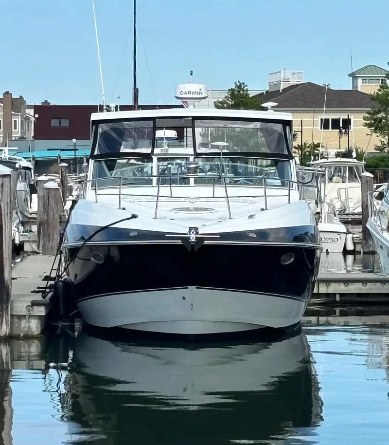 Slide: The Image of 2011 Cruisers Yachts 330 Express docked in a marina. - 4