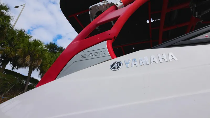 Slide: The Image of Close-up of 2018 Yamaha Boats 242 XE with red accents and logo. - 11