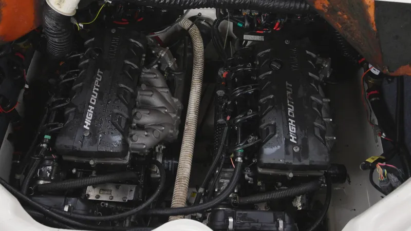 Slide: The Image of 2018 Yamaha Boats 242 XE engine compartment with dual high-output engines. - 14