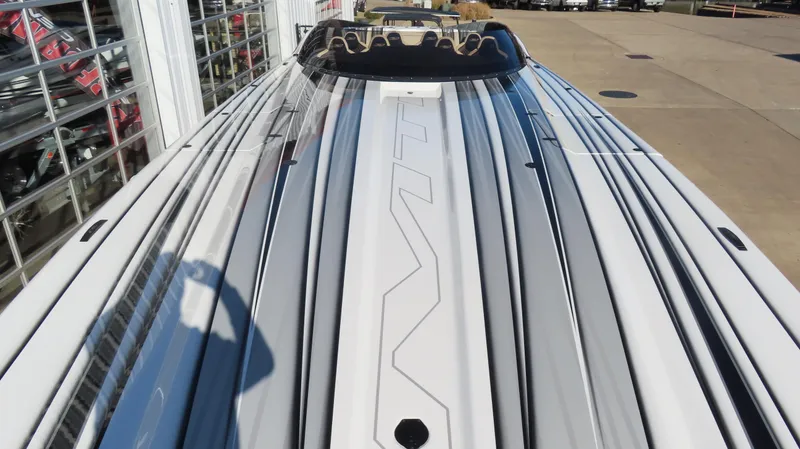 Slide: The Image of 2020 MTI 48 boat with sleek design and modern detailing, viewed from above. - 11