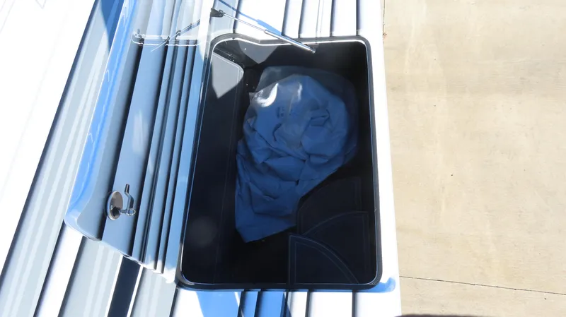 Slide: The Image of Storage compartment on 2020 MTI 48 boat with fabric inside. - 13