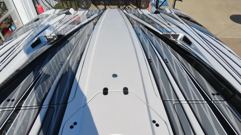 Slide: The Image of 2020 MTI 48 boat deck with sleek, modern design and striped pattern. - 15