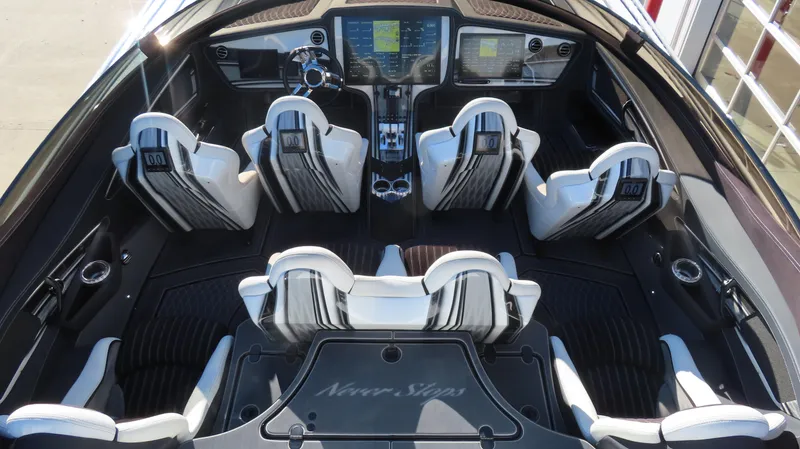 Slide: The Image of 2020 MTI 48 boat interior with modern dashboard and white seating. - 17