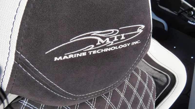 Slide: The Image of MTI 48 2020 boat seat with Marine Technology Inc. logo embroidery. - 22