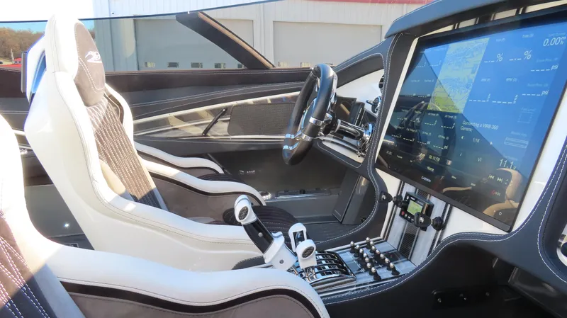 Slide: The Image of Interior of a 2020 MTI 48 boat with modern dashboard and sleek seating. - 23
