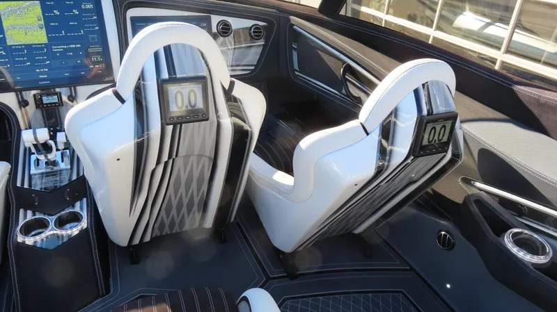 Slide: The Image of Interior of a 2020 MTI 48 boat with modern seats and digital displays. - 30
