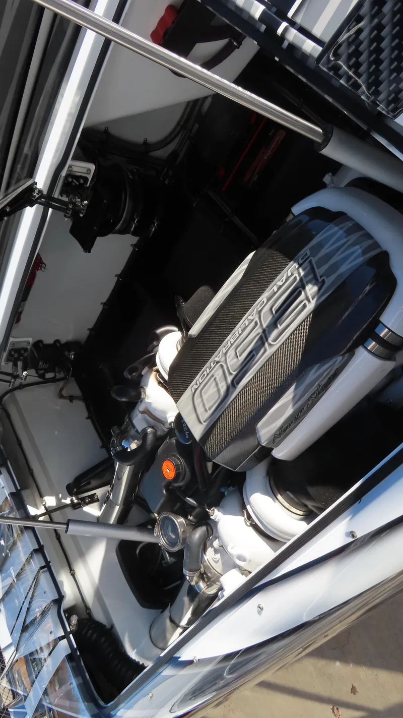 Slide: The Image of 2020 MTI 48 engine compartment with visible components and carbon fiber detailing. - 37