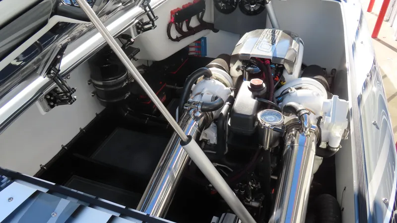 Slide: The Image of Engine compartment of a 2020 MTI 48 boat, featuring dual high-performance engines. - 38